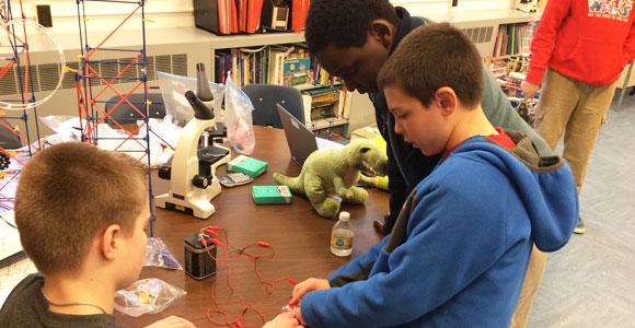 boys playing with battery